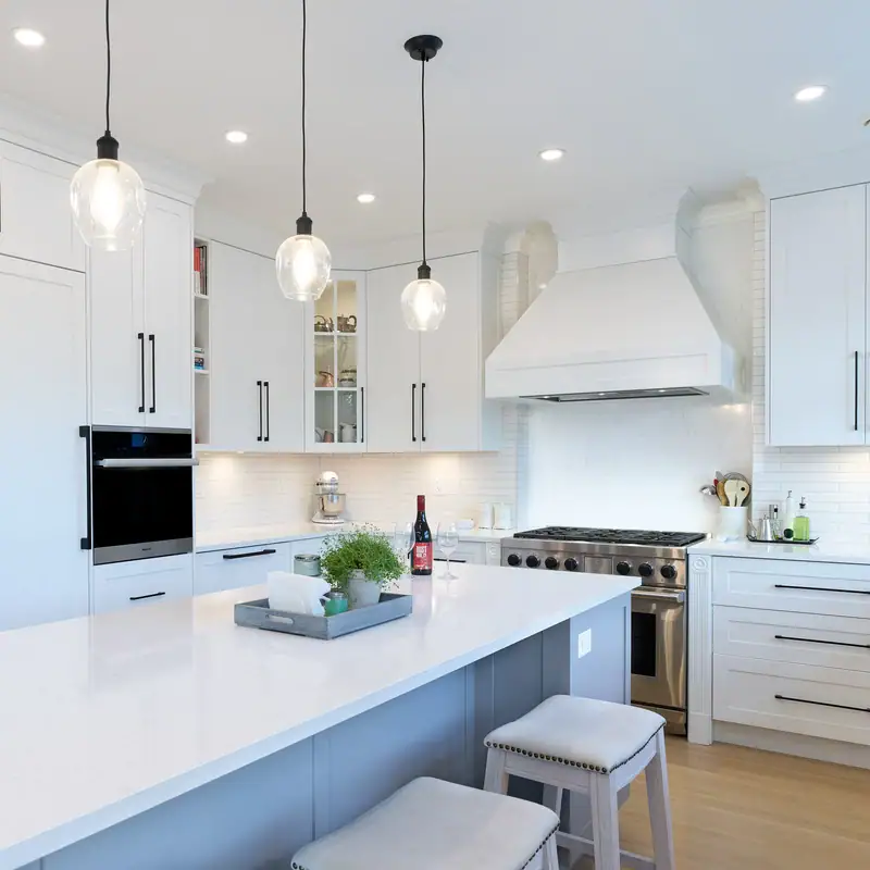 reVISION Dogwood Custom renovation Kitchen and Dining - white cabinets and large island